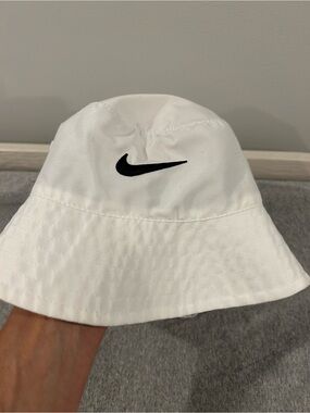 Nike Toddler White Bucket Hat with Black Swoosh Logo.